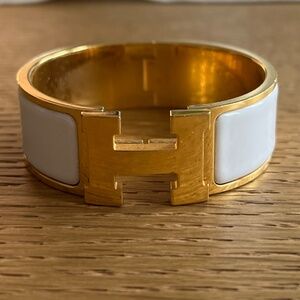 HERMES GOLD TONED WHITE CERAMIC CLIC CLAC BRACELET